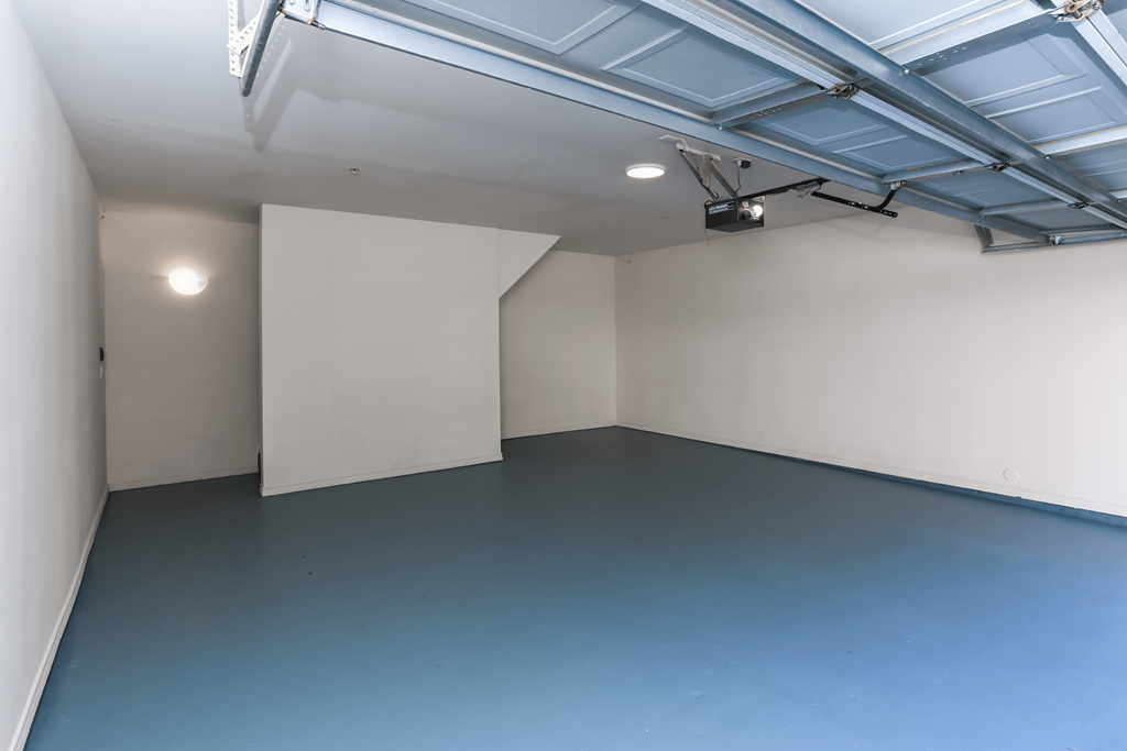 A room with a blue floor and white walls.